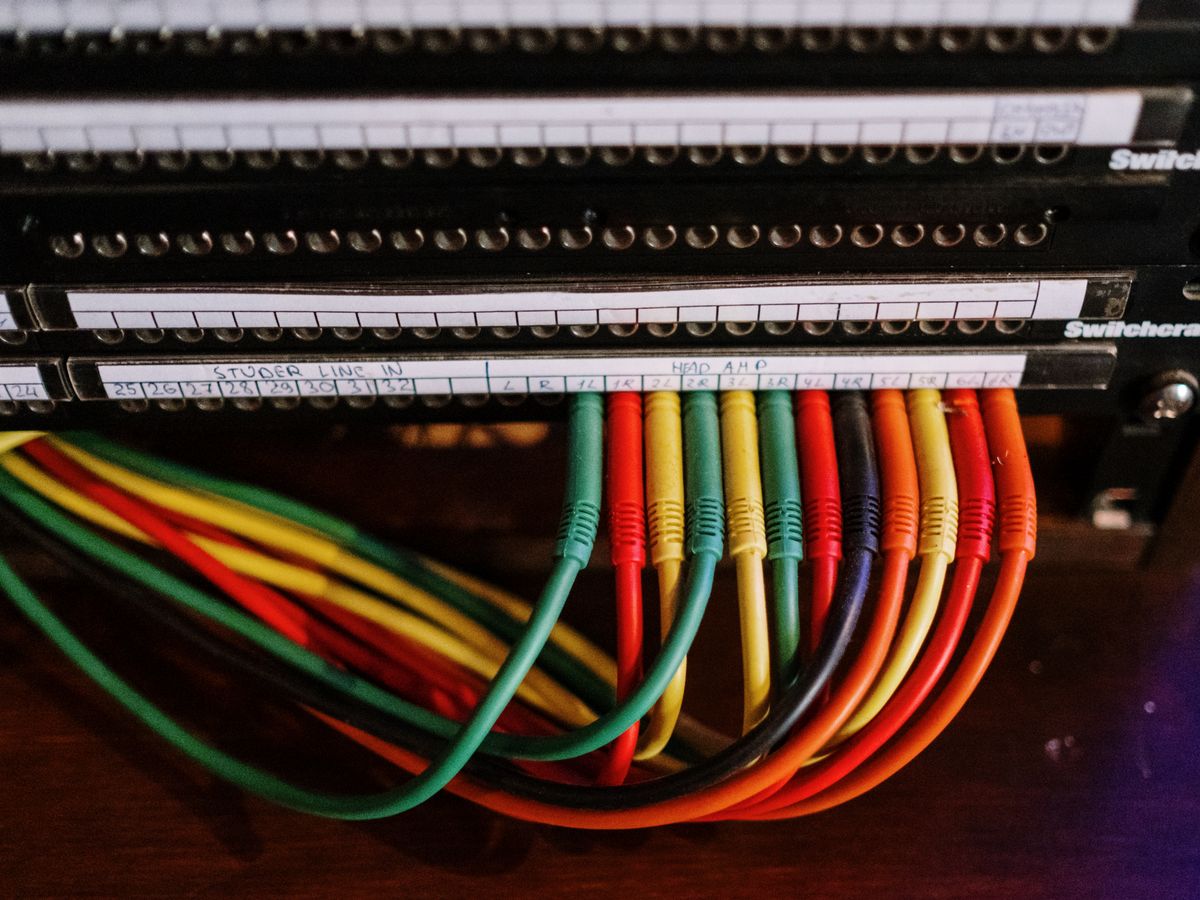 Patch panel with colour-coded network cabling
